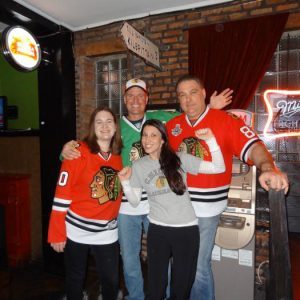 chicago singles club members hanging out at a bar watching hockey