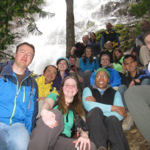 seattle singles club members hiking near a waterfall