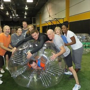 dallas singles club members having fun inside inflatable hamster balls