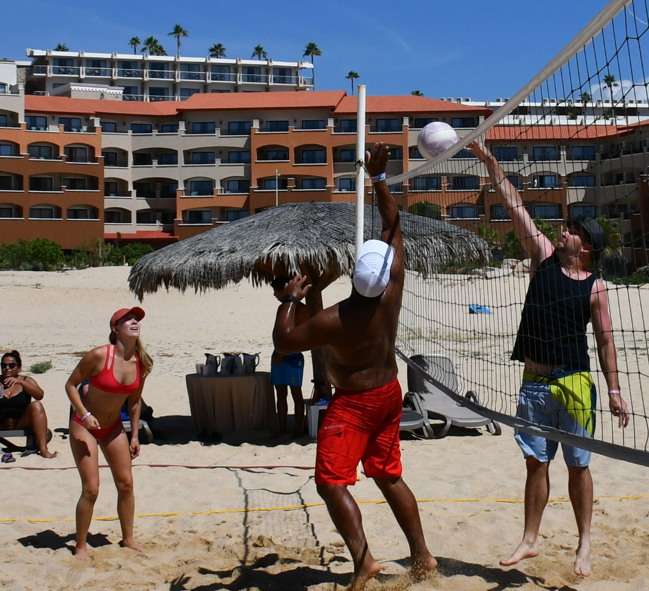 single members playing volleyball